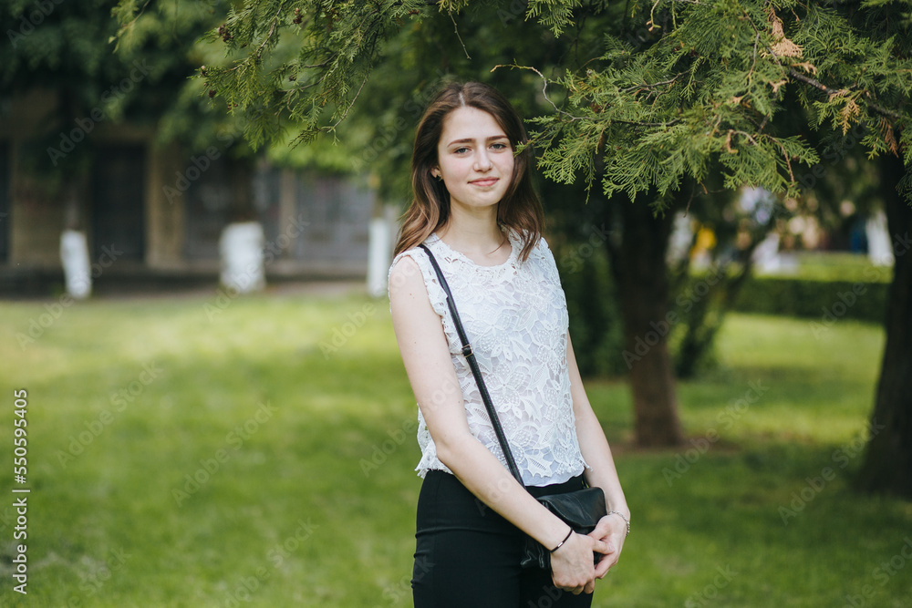 Beautiful young girl smiling in the park. healthy new life image Beautiful young girl smiling in the park. healthy new life image