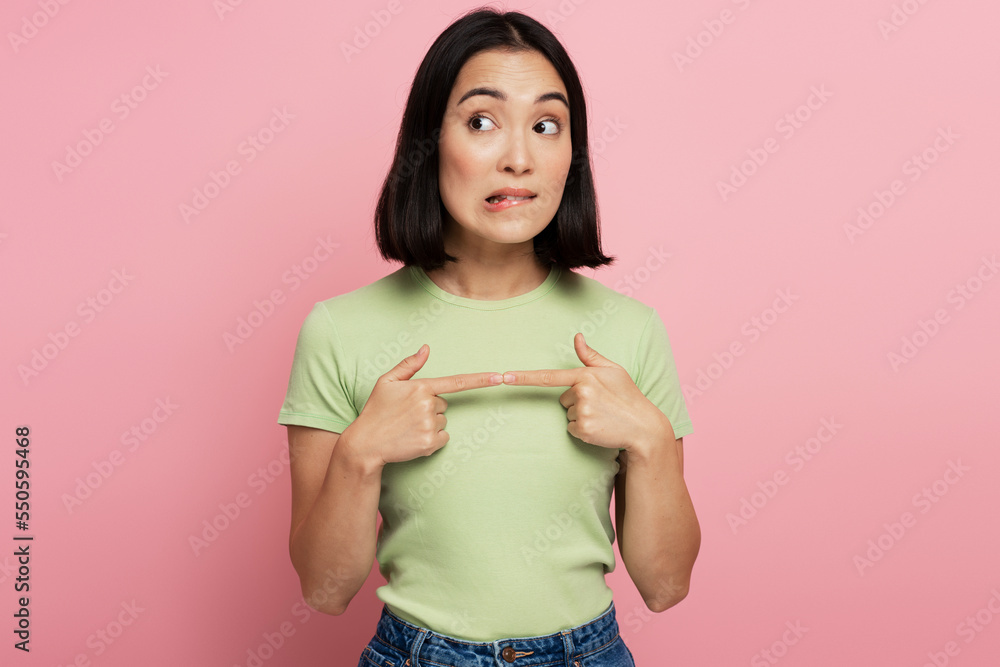Thoughtful girl pondering serious issues, looking with uncertain hesitant expression Thoughtful girl pondering serious issues, looking with uncertain hesitant expression
