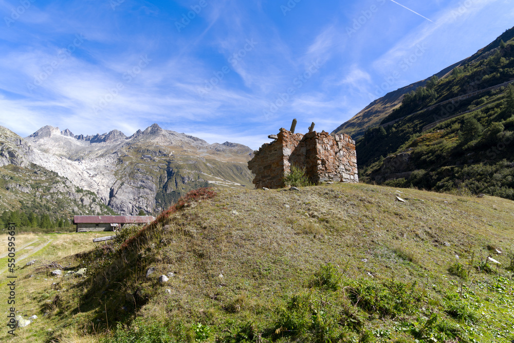 Ruin at mountain village Gletsch, Canton Valais, on a sunny late summer day. Photo taken September 12th, 2022, Gletsch, Switzerland. Ruin at mountain village Gletsch, Canton Valais, on a sunny late summer day. Photo taken September 12th, 2022, Gletsch, Switzerland.