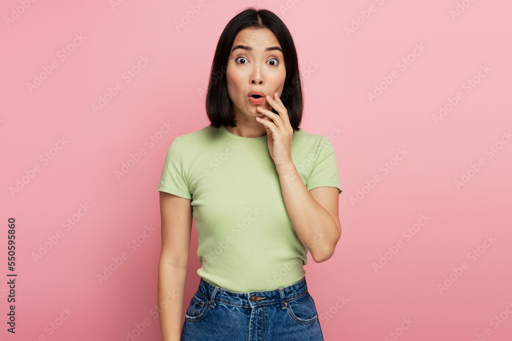 Surprised woman looking at camera with mouth open in amazement Surprised woman looking at camera with mouth open in amazement