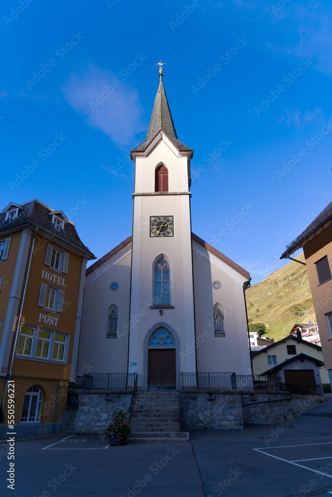 Fototapeta premium Mountain village Realp, Canton Uri, with catholic church on a late summer day. Photo taken September 12th, 2022, Realp, Switzerland.