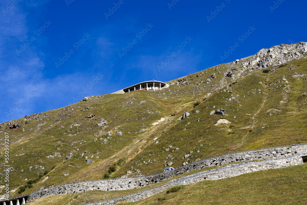 Aerial view of mountain panorama in the Swiss Alps at region of Swiss mountain pass Furkapass on a sunny late summer day. Photo taken September 12th, 2022, Furka Pass, Switzerland.