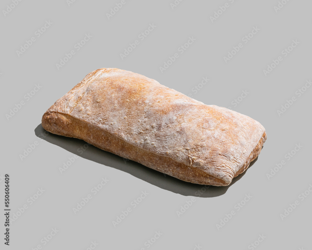 Classic ciabatta bread isolated on grey background closeup Classic ciabatta bread isolated on grey background closeup