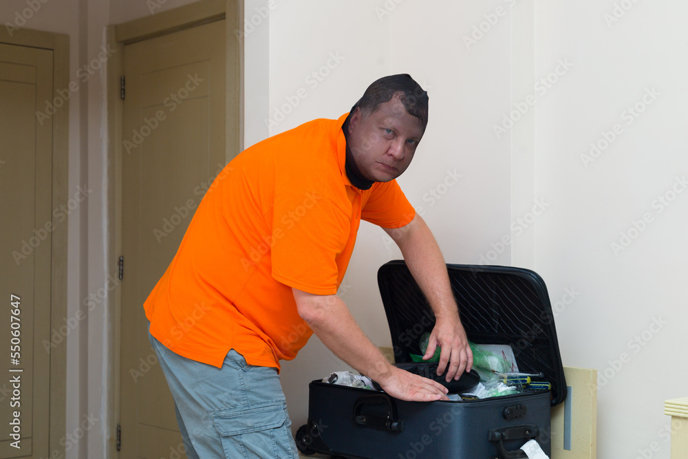 thief broke into hotel room and checks someone else suitcase. thief broke into hotel room and checks someone else suitcase.