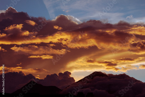 Horizon at sunset, dramatic sky with intense colors in rural Guatemala, bright colors and silhouettes of mountains.
