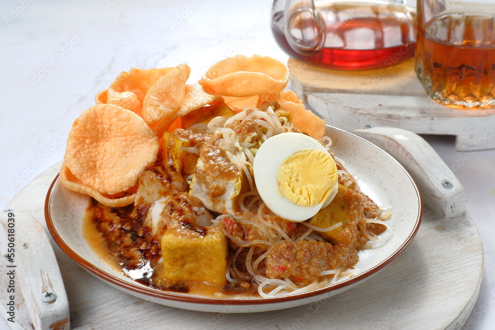 ketoprak-indonesian Traditional street food.dish of rice cake,rice noodles, bean curd, egg,boiled sprouts and served with peanut dressing.