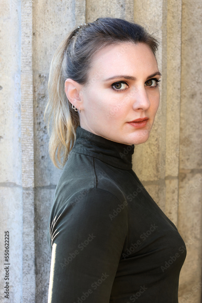 portrait of a young woman with ponytail in a turtleneck portrait of a young woman with ponytail in a turtleneck
