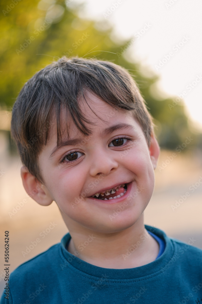 The cute little boy has rotten teeth because of eating too much candy. The cute little boy has rotten teeth because of eating too much candy.