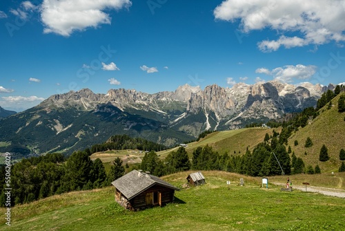 Great view of Col Rodella mountain range in Val di Fassa valley with hiking trails under blue sky photo