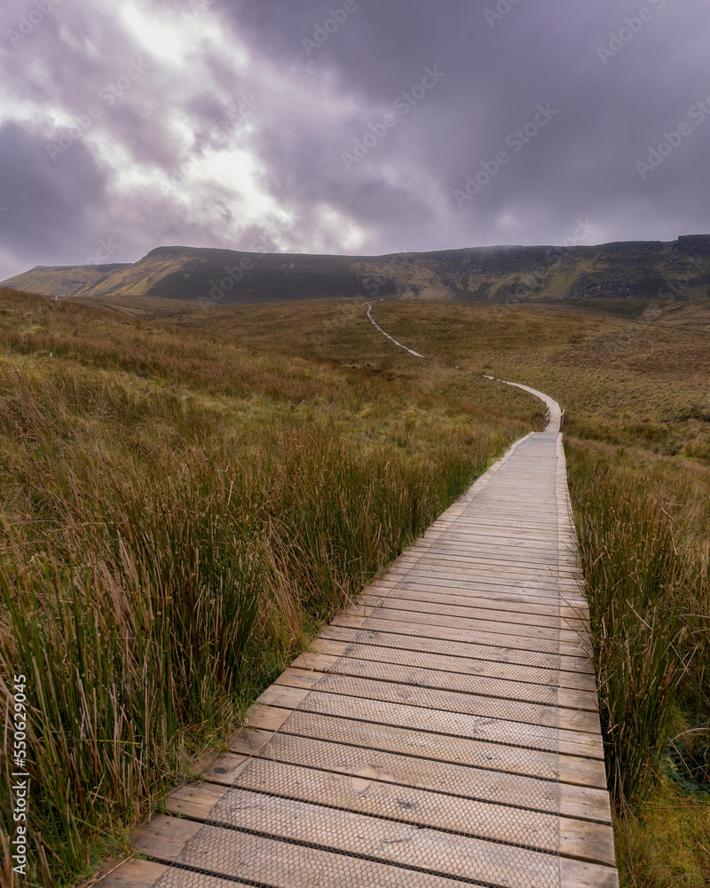 Wooden trail through beautiful countryside up a mountain. Cuilcagh Boardwalk Trail in Fermanagh, Northern Ireland. Stairway To Heaven