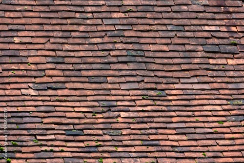 background texture of old red clay roof tiles 