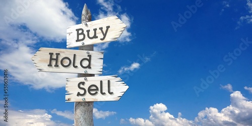 Bild auf Leinwand Buy, hold, sell - wooden signpost with three arrows