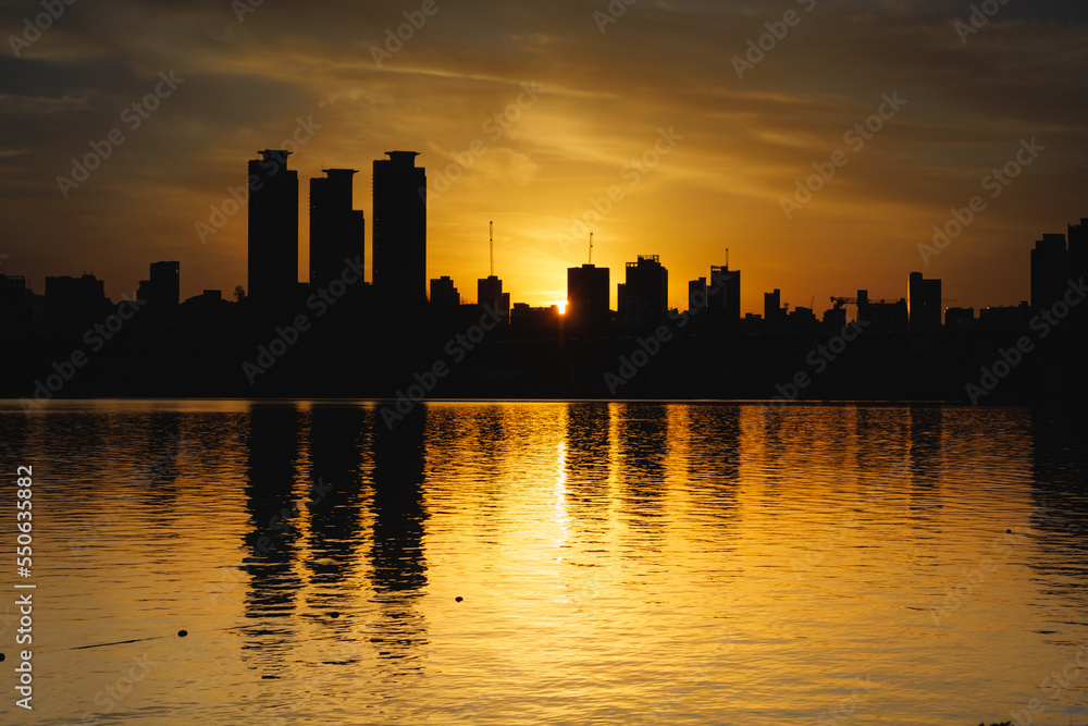 Sunset moment, golden sky, city skyline silhouette and golden Han River