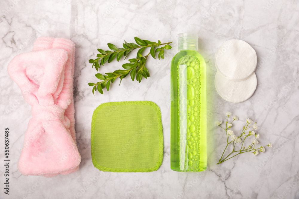 Micellar cleansing water, cotton swabs, towel and pads for removing makeup and cleansing the skin of sebum. Beauty concept. Skin care. Space for text. MOCAPS. FLETLY Micellar cleansing water, cotton swabs, towel and pads for removing makeup and cleansing the skin of sebum. Beauty concept. Skin care. Space for text. MOCAPS. FLETLY
