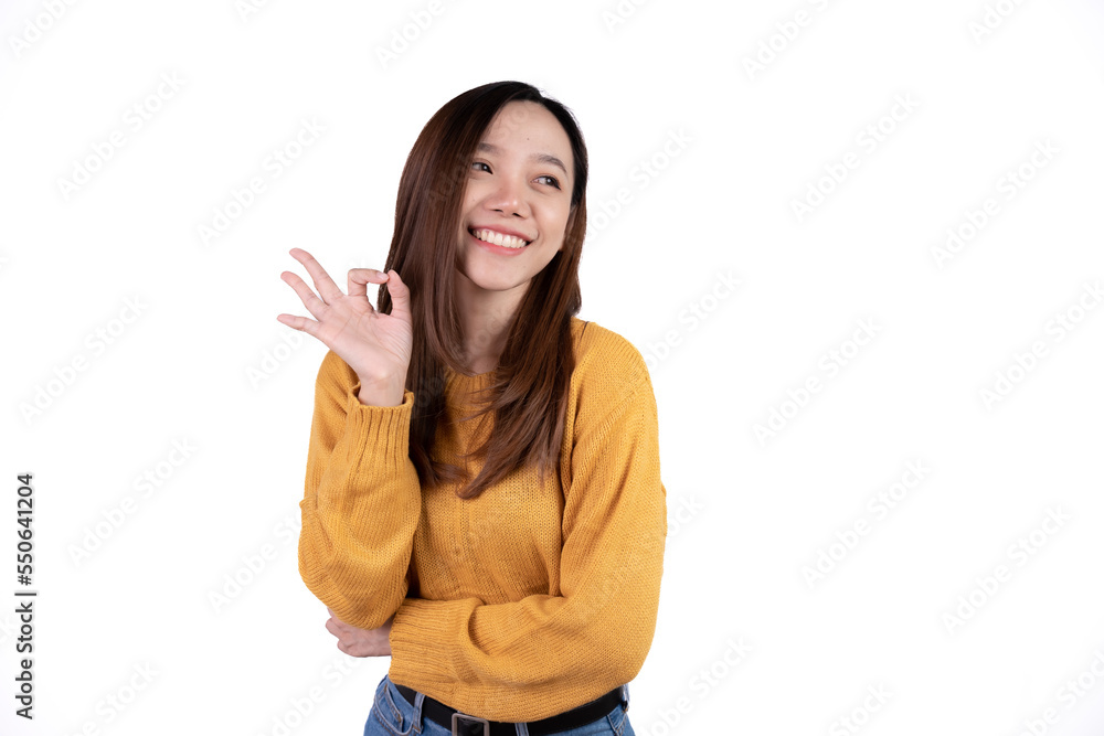 Portrait happy Asian woman shows ok sign and looking at the camera isolated on white background. Portrait happy Asian woman shows ok sign and looking at the camera isolated on white background.