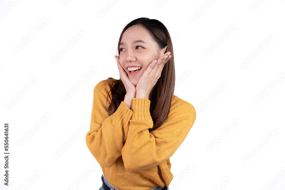 Excited young lady standing isolated over white background make winner's gesture. Excited young lady standing isolated over white background make winner's gesture.