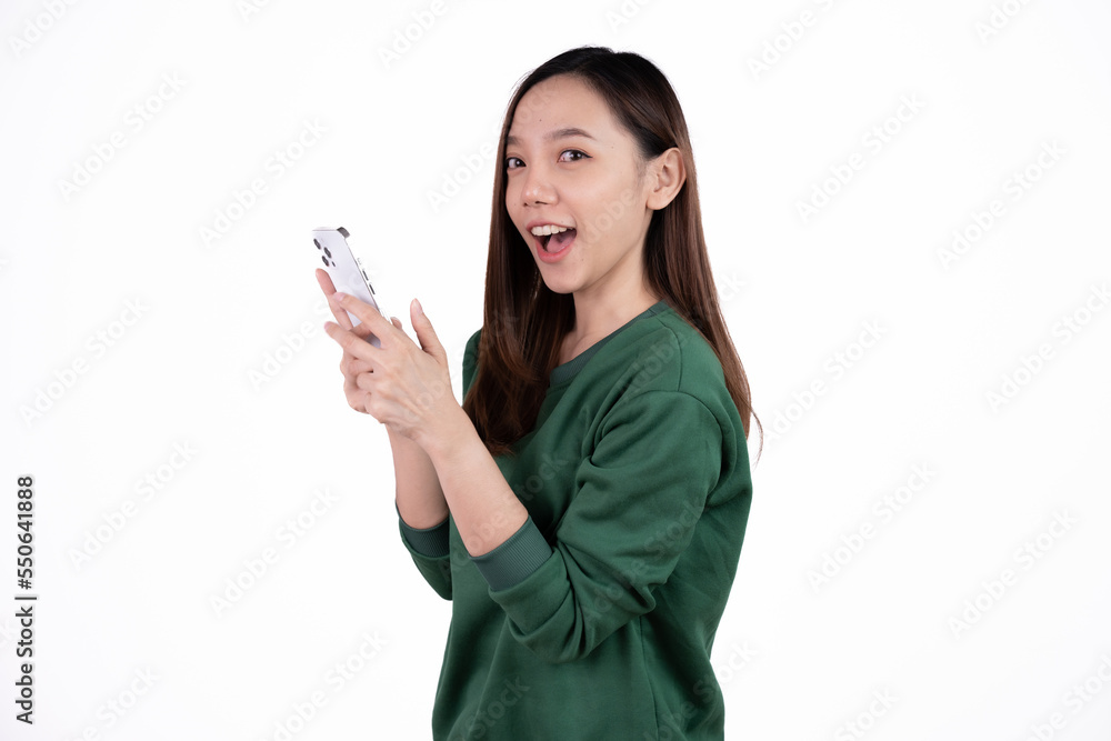 Portrait of a smiling casual asian woman holding smartphone over white background. Portrait of a smiling casual asian woman holding smartphone over white background.