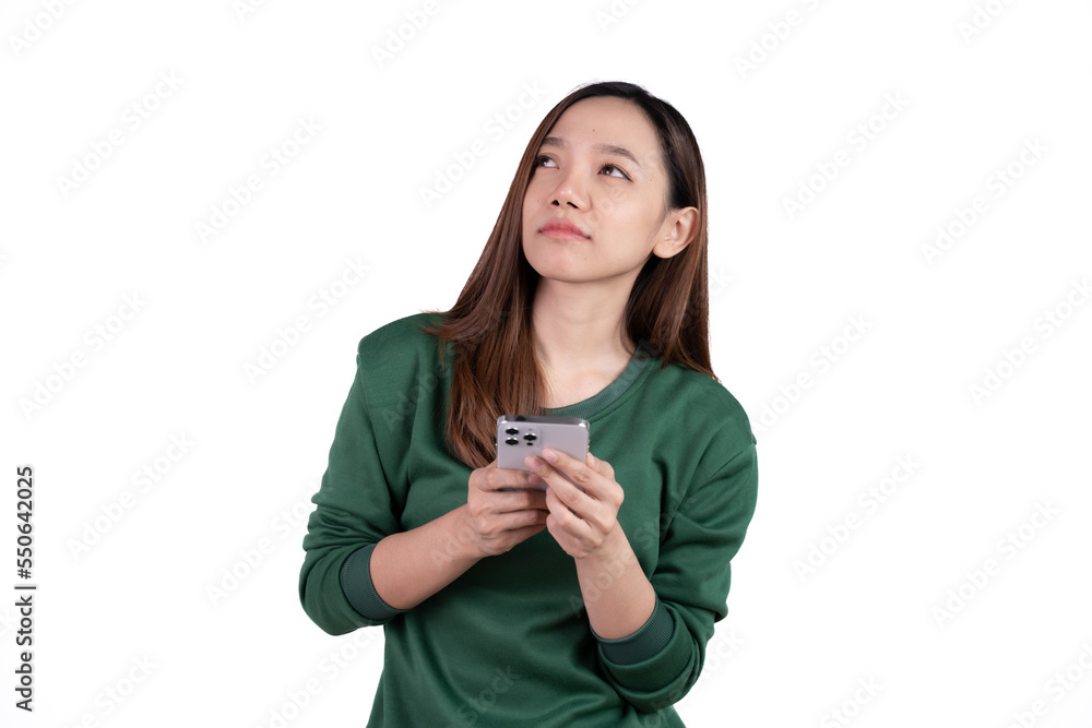 Portrait of a smiling casual asian woman holding smartphone over white background. Portrait of a smiling casual asian woman holding smartphone over white background.