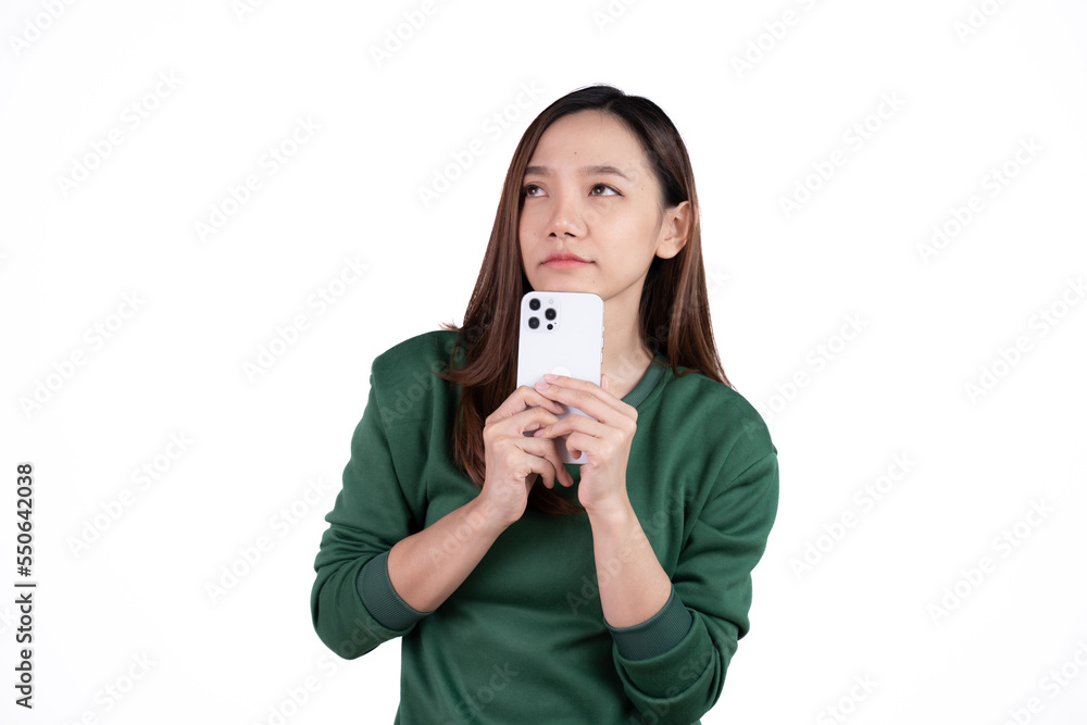 Portrait of a smiling casual asian woman holding smartphone over white background. Portrait of a smiling casual asian woman holding smartphone over white background.