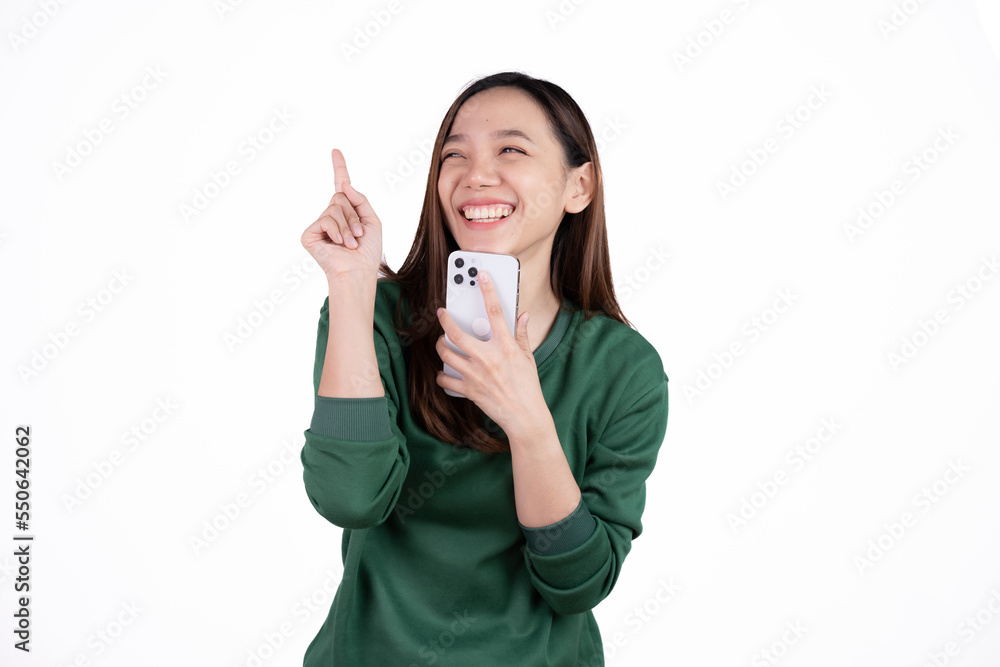Portrait of a smiling casual asian woman holding smartphone over white background. Portrait of a smiling casual asian woman holding smartphone over white background.