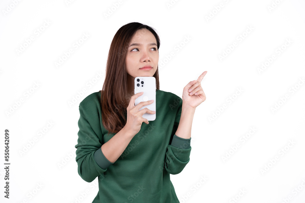 Portrait of a smiling casual asian woman holding smartphone over white background. Portrait of a smiling casual asian woman holding smartphone over white background.