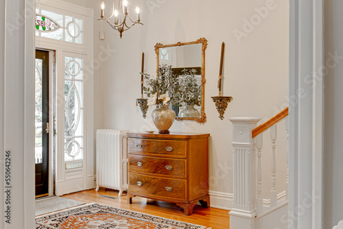 Entryway interior historic foyer traditional decor window white railing rowhome