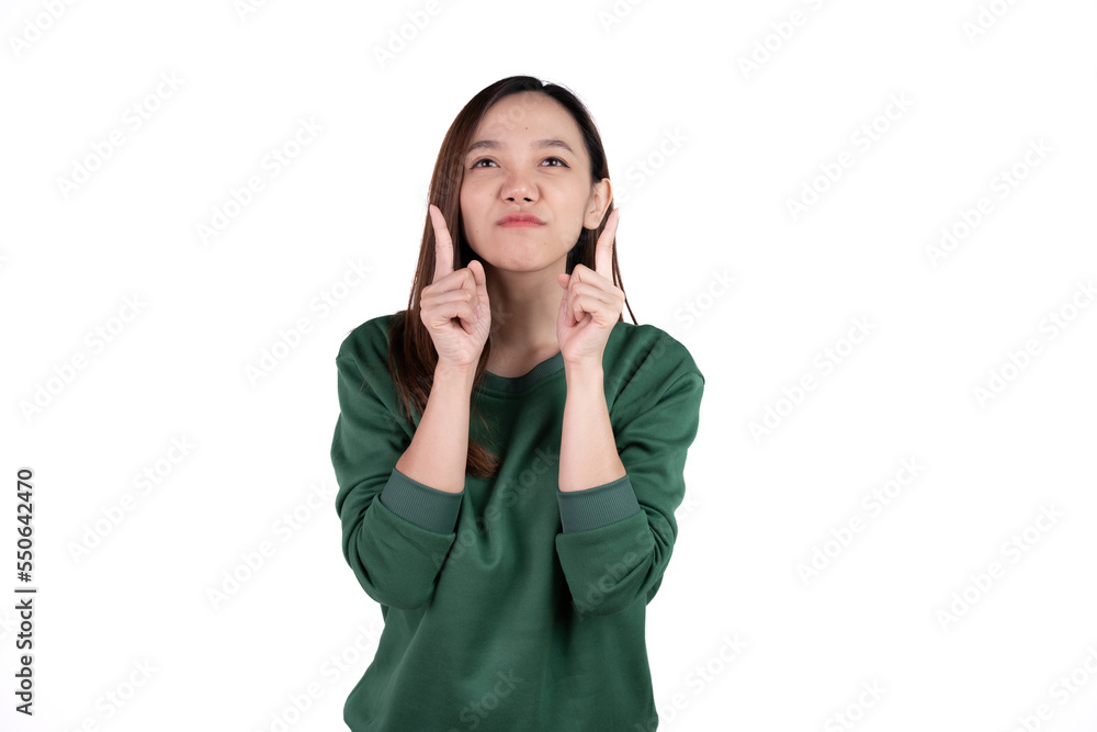 Young beautiful smiling good mood positive girl pointing finger in copyspace isolated on white background. Young beautiful smiling good mood positive girl pointing finger in copyspace isolated on white background.