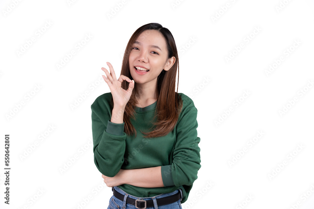 Portrait happy Asian woman shows ok sign and looking at the camera isolated on white background. Portrait happy Asian woman shows ok sign and looking at the camera isolated on white background.