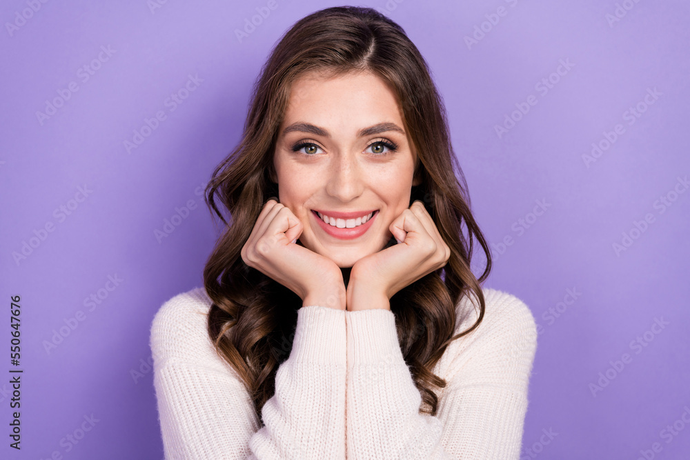 Portrait of young adorable brunette hair nice woman wear white jumper touch cheeks enjoy herself good mood isolated on violet color background Portrait of young adorable brunette hair nice woman wear white jumper touch cheeks enjoy herself good mood isolated on violet color background