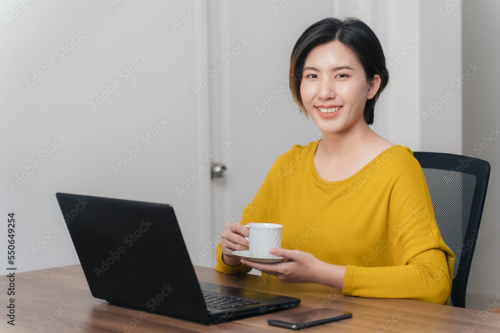 Asian woman businesswoman drinking coffee to cure sleepiness concept, asian woman having fun drinking coffee during work Asian woman businesswoman drinking coffee to cure sleepiness concept, asian woman having fun drinking coffee during work