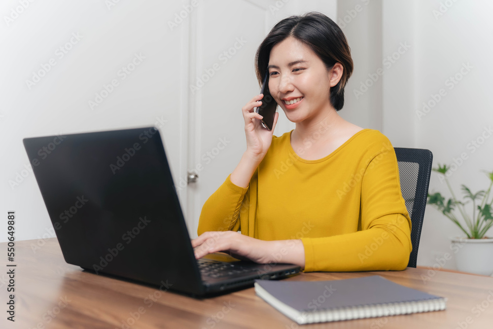 A young businesswoman is very happy after checking her email through her laptop. A young businesswoman is very happy after checking her email through her laptop.