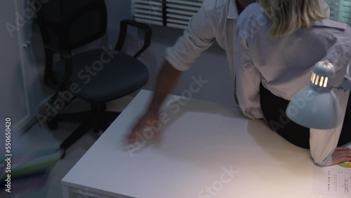 Young Caucasian couple having sex in the office.