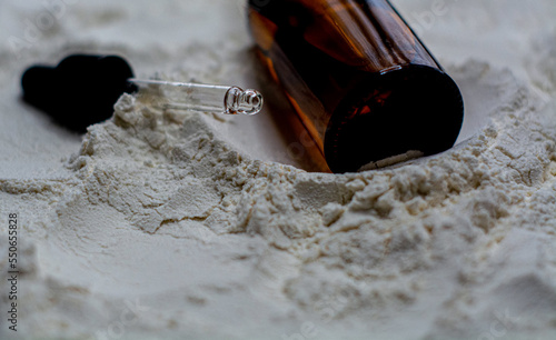 Obraz na płótnie Natural cosmetics face oil in brown bottle on the sand w salonie