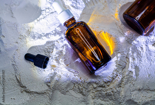 Obraz na płótnie Natural cosmetics face oil in brown bottle on the sand w salonie