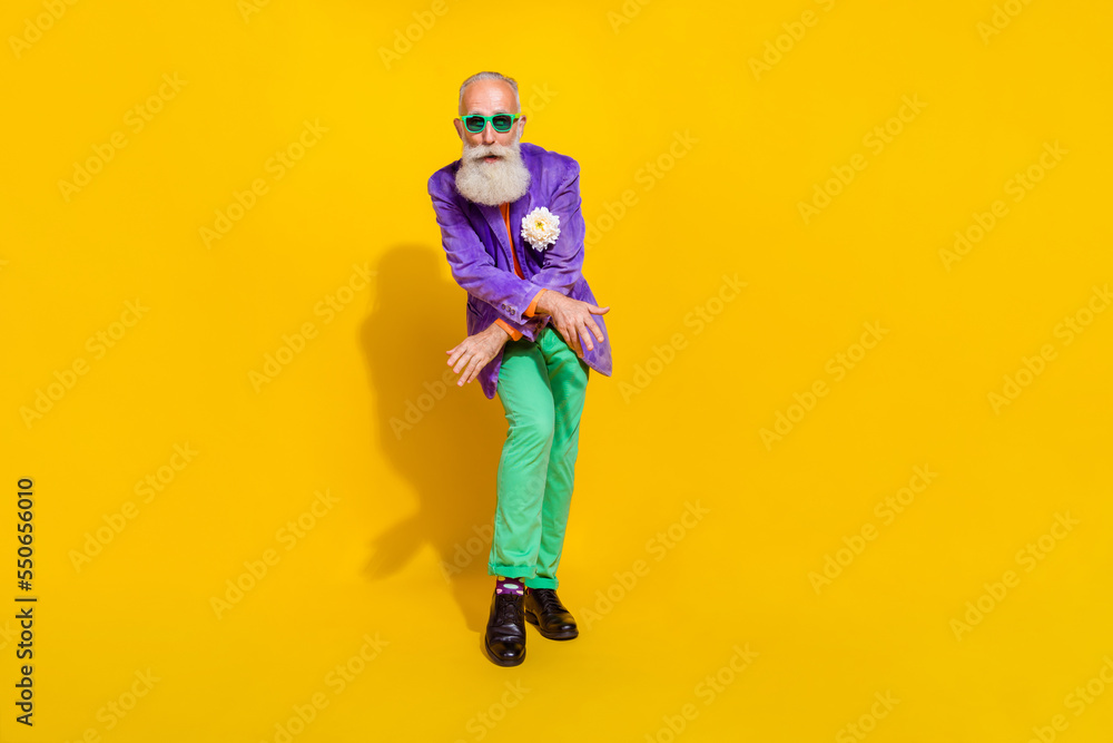 Full length photo of cheerful cool guy dressed violet velvet jacket having disco fun isolated yellow color background Full length photo of cheerful cool guy dressed violet velvet jacket having disco fun isolated yellow color background
