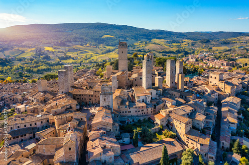Town of San Gimignano, Tuscany, Italy with its famous medieval towers. Aerial view of the medieval village of San Gimignano, a Unesco World Heritage Site. Italy, Tuscany, Val d'Elsa. photo
