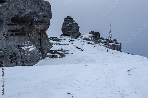 Rocks on the top of Mount Alenga. Southern Demerdzhi in snow and ice in spring. Crimea