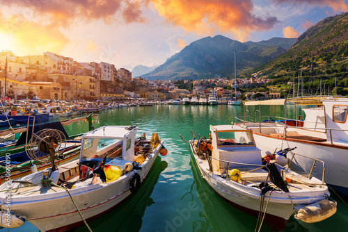 Fototapeta Naklejka Na Ścianę i Meble -  Sicilian port with fishing boats of Castellammare del Golfo village of Sicily, Trapani, Italy. Castellammare del Golfo town (Gulf of Castellammare) on Mediterranean Sea, Trapany, Sicily, Italy.