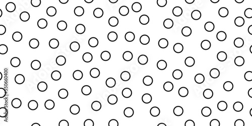 Simple black rings scattered throughout the seamless canvas. Vector print for various interior design or decor.