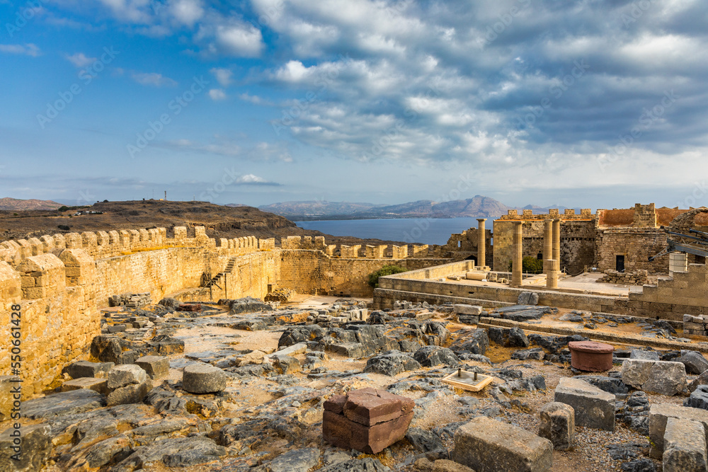 Fototapeta premium Ruins of Acropolis of Lindos view, Rhodes, Dodecanese Islands, Greek Islands, Greece. Acropolis of Lindos, ancient architecture of Rhodes, Greece.
