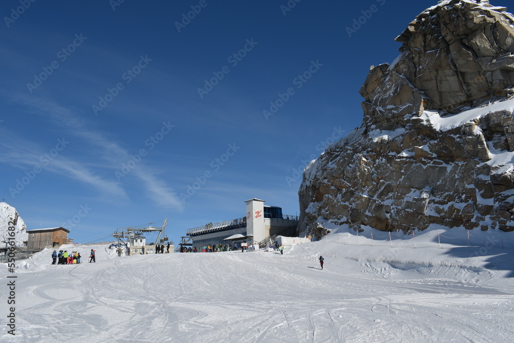 Sunny day on a Hintertux glacier (photo taken from 3250 meters above sea level) with view of Tirol Alps