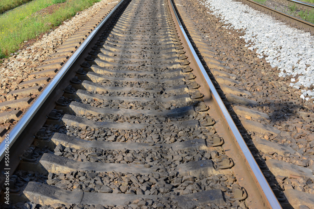 Fototapeta premium railway isolated going forward in sunny day, close-up 