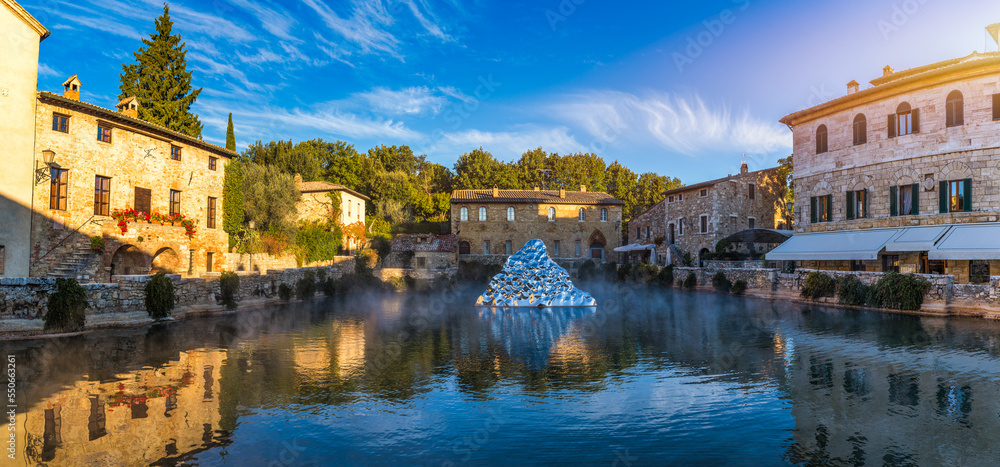 Thermal bath town of Bagno Vignoni, Italy during sunrise. Old thermal baths in the medieval village Bagno Vignoni, Tuscany, Italy. Medieval thermal baths in village Bagno Vignoni, Tuscany, Italy