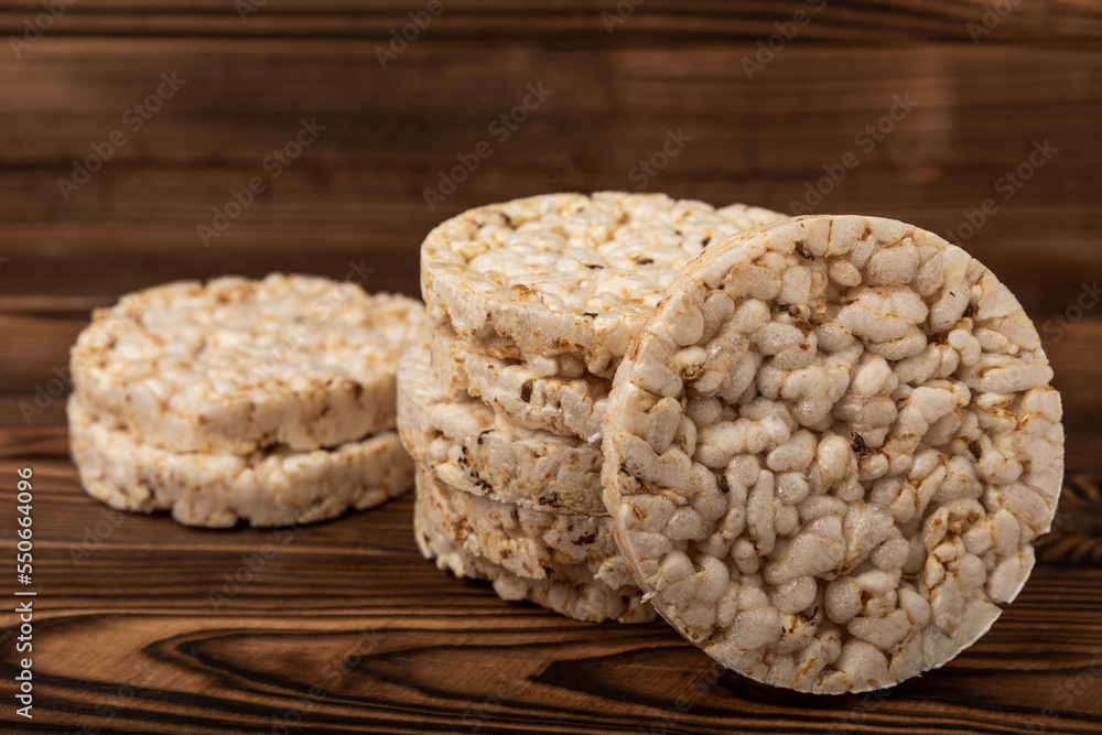 Rice cakes on an old brown tree. Diet bread. Useful food. Diet food. Gluten free. Space for copy. Space for text. Rice cakes on an old brown tree. Diet bread. Useful food. Diet food. Gluten free. Space for copy. Space for text.