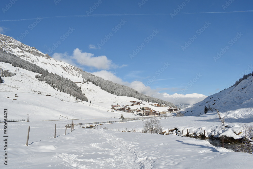 Austrian village under snow on a sunny, winter day