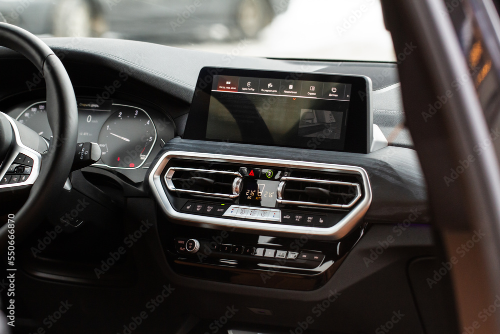 Digital car radio. Modern car radio in car. Smart multimedia touchscreen system..