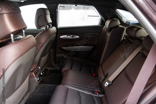 Modern SUV car inside. Leather light back passenger seats in modern luxury car. Comfortable leather seats. © Roman
