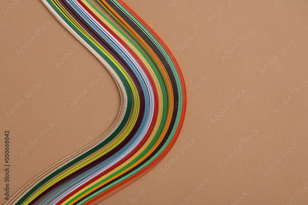 Paper strips for creativity on a beige background Paper strips for creativity on a beige background
