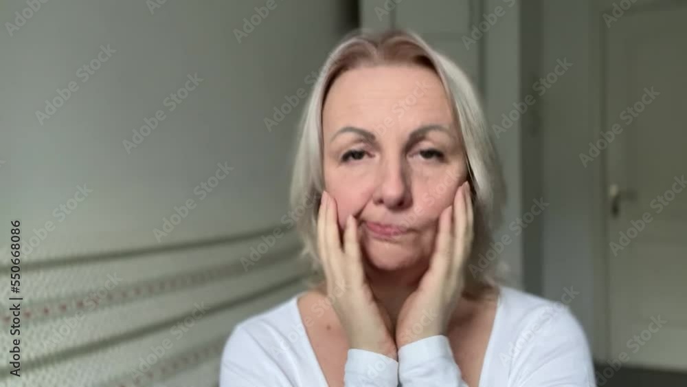 Pretty upset woman Adult woman with white hair is offended She shows her tongue expressively Her eyebrows are shifted, she is puffed up and does not want to talk to anyone Pretty upset woman Adult woman with white hair is offended She shows her tongue expressively Her eyebrows are shifted, she is puffed up and does not want to talk to anyone