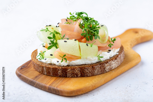 Open sandwich with turkey ham, fresh cucumber and cream cheese